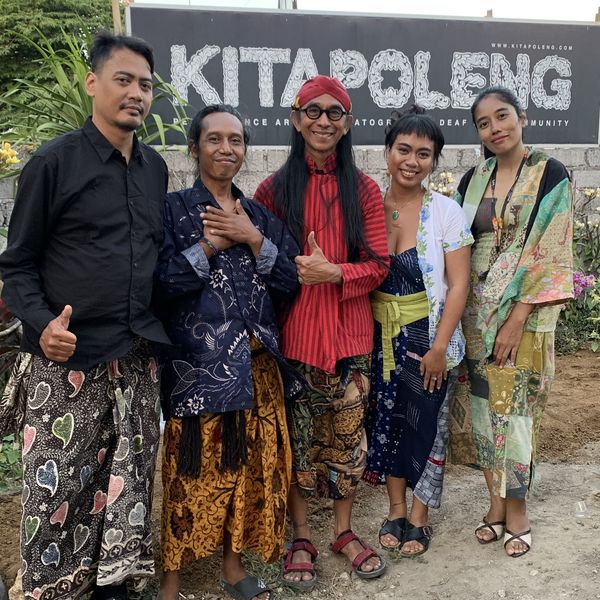 The Kala Loka team with the Kitapoleng community in front of the Kitapoleng sign